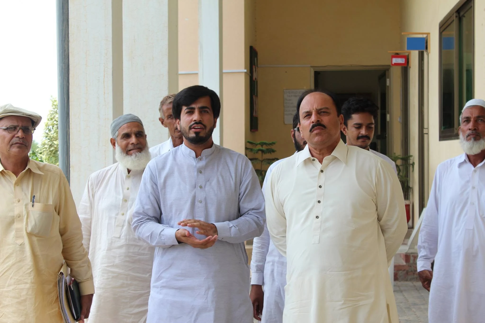 Ch. Muhammad Aslam Sikho, then Chairman BISE Gujranwala, visiting Danish International Grammar School with Faruukh Nadeem and school representatives in 2014.