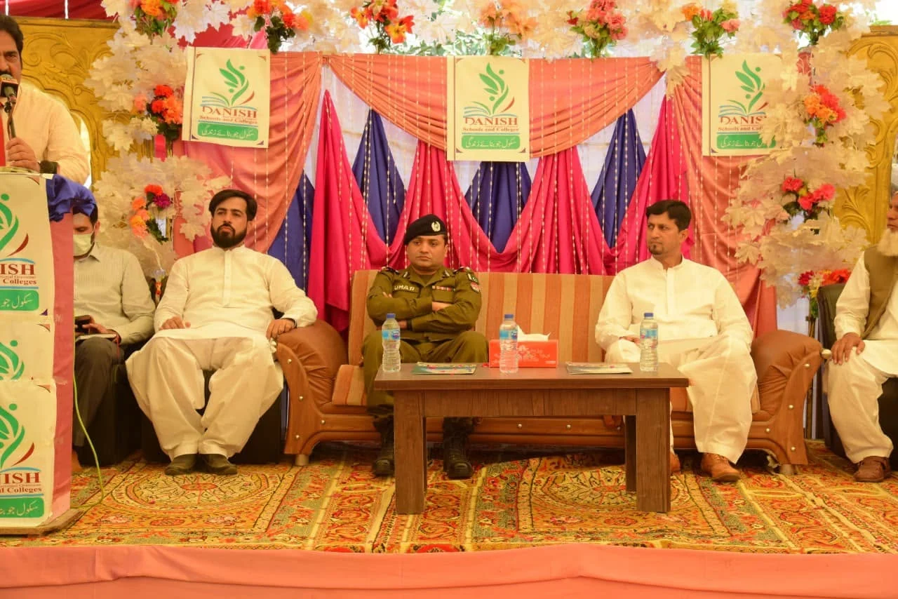 DPO Gujrat Muhammad Umar Farooq Salamat seated with school representatives during the programme.