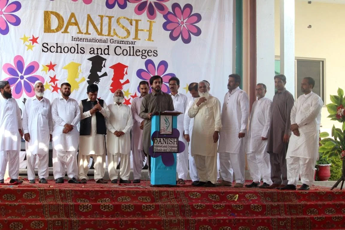 A wide stage view of the academic celebration at Danish International Grammar Schools and Colleges.